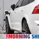 A Volvo XC60 hybrid car is seen plugged into a charging point outside a Volvo dealership in Reading, west of London, on March 2, 2021. - Chinese-owned Swedish automaker Volvo said on March 2 it will produce only electric vehicles by 2030 and sell them all exclusively online.
